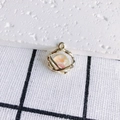 Macro detail of bird's nest gold pendant with peach resin bead and tiny zircon stone - 2#(Gold Nest Hollow)