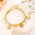 Golden hip hop chain bracelet featuring a letter W pendant and classic coin charms - Queen Portrait - Letter W (7838)