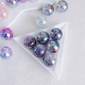 Close-up of 16mm cracked glass style acrylic flower beads with AB iridescent coating - Blue Purple Pink Gradient (2#)