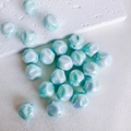 Macro shot of 16mm light blue irregular crumpled acrylic beads with iridescent finish - Light Blue (1#)