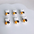 Macro shot of 6 ceramic lucky cat beads for DIY jewelry making on white tray - Calico Cat Pattern (KP5452)