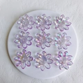 Macro view of purple AB aurora acrylic flower pendants with nine pieces on a white tray - 38x5mm / Lilac Large