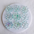 Macro shot of 9 colorful aurora acrylic flower charms for DIY jewelry making - 38x5mm / Water Blue Large