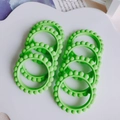 Macro detail of green beaded acrylic rings on white tray for DIY jewelry making - 1# (Bright Green)