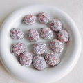 Close-up of pink crystal rhinestone-encrusted oval beads on white ceramic tray - Pink Pearlescent (9#)