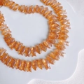 Detail of translucent orange fish-shaped glass beads for DIY jewelry making and crafts - Amber Orange (3#)