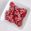 DIY red heart-shaped charms with sparkling rhinestones presented in a white ceramic bowl - Red