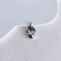 Detail shot of a liquid-style irregular silver pendant on a white ceramic plate - Silver Irregular Liquid Style (8#)
