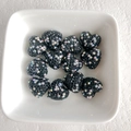 DIY heart beads with black base and AB crystals in a white ceramic dish - Black AB Color
