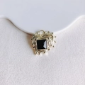 Detailed view of heart-shaped gold pendant with irregular lava texture and black gemstone - Gold Black Gemstone (2#)