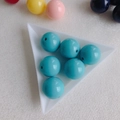Macro shot of 10mm sky blue acrylic round beads in a white triangular tray for DIY jewelry - Sky Blue (12#)