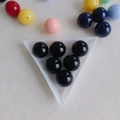 Close-up of black acrylic round beads in a triangular tray for DIY jewelry making - Black (15#)