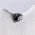 Macro view of gothic heart pendant with black faceted gemstone and molten metal texture - Gunmetal Black Gemstone (12#)