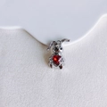 Macro detail of a silver rabbit charm featuring a large red heart-shaped gemstone - Silver With Red Heart (4#)