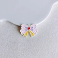 Close-up of a colorful enamel alloy butterfly pendant with a red heart for DIY jewelry - Pink Purple Yellow Heart Bow (30#)
