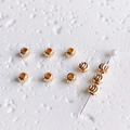 Detail of 14K gold filled textured spacer beads for DIY jewelry making with spiral pattern - 5mm
