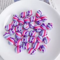Macro detail of rainbow striped acrylic beads with green dots for DIY jewelry making - Purple Pink White Green Spiral Pattern (8# Lampwork)