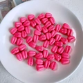 Detailed close-up of bright pink tulip acrylic beads for DIY jewelry making in a white tray - Bright Pink Flower Bud Bead (03#)