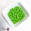 Glossy lime green 2-hole tile beads in a white bowl for DIY jewelry making - Bright Green