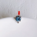 Detailed macro view of a blue faceted crystal pendant with silver metal claw setting - Silver Base Blue Rhinestone (9#)