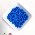 Dark blue oval spacer beads for DIY jewelry making displayed in a white square bowl - Dark Blue