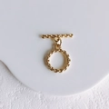Detailed close-up of golden OT toggle clasp with twisted texture for DIY jewelry making - Style 1 OT Toggle Clasp (K Gold)