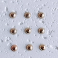 Macro detail of nine 18K gold plated flower bead caps for DIY jewelry necklace making - Style 4 (4#) / Medium / 14K Gold