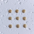 Macro view of six-petal hollow gold flower bead caps for DIY jewelry making - Style 9 (9#)