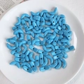 Light blue double-hole crescent beads for DIY crafts on a white ceramic tray - Light Blue Moon Shaped Bead (8#)