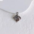 Macro detail of silver square pendant with spiral relief pattern for DIY jewelry making - Silver Square Relief (4#)