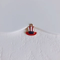 Macro shot of American Uncle Sam hat pendant with red white stripes and blue starry band - Uncle Sam Hat Shape (3#)
