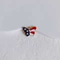 Macro shot of gold-plated butterfly pendant with American flag pattern for DIY jewelry - Flag Element Butterfly Shape (4#)
