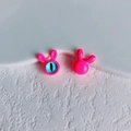 Macro detail of neon pink bunny-shaped DIY beads with blue eye and glossy resin finish - 13# (Fluorescent Pink)