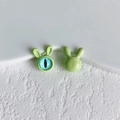 Detail of light green rabbit-shaped alloy bead with blue cat-eye pupil and glossy finish - 14# (Bright Green)