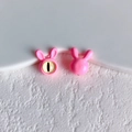 Detail of pink resin bunny beads showing front with yellow eye and smooth glossy back view - 16# (Pink Purple)