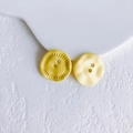 Detail of yellow flower-shaped metal buttons with dual holes for DIY jewelry making - Ginger Yellow Button (3# Large)
