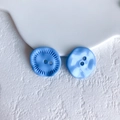 Detail of two sky blue decorative buttons with radial texture and wavy smooth surface - Sky Blue Button (9# Large)