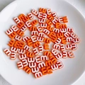 Macro view of bright orange letter m beads for DIY jewelry and phone chain making - Bright Orange Style (1)