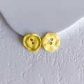 Macro detail of bright yellow button shaped floral pendants on a white texture background - Bright Yellow Button (17# Medium)