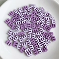 Macro detail of purple candy-colored letter M beads for DIY jewelry and hair accessories - Purple Style (4)