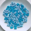 Macro shot of sky blue letter m beads in a ceramic tray for DIY jewelry making - Sky Blue Style (5)