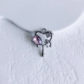 Macro detail of a silver fluid heart pendant with purple gemstone and zirconia - Silver Purple Open Heart (14#)