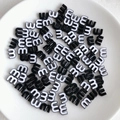Close-up of black and white candy-colored letter M beads for DIY jewelry making - Black and White Style (10)