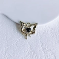 Detail of a gold butterfly pendant with a black heart and sparkling rhinestones - Gold Black Butterfly (17#)