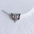 Macro view of silver butterfly pendant with pink heart gemstone and sparkling zircons - Silver Pink Butterfly (18#)