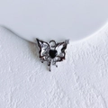 Macro shot of silver butterfly pendant with black heart center and sparkling rhinestones - Silver Black Butterfly (19#)
