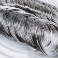 Macro detail of silver memory wire coils for DIY beaded bracelet jewelry making projects - One Roll / Steel