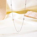 Elegant silver four-leaf clover necklace displayed on aesthetic satin background - Clover/Flower Pendant / Silver Style (81534)