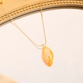 Detail of amber pear-shaped pendant on gold chain reflected on a vintage mirror - Yellow (Gold Chain)
