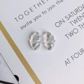Macro detail of translucent aurora bow-knot resin charms with iridescent finish - Aurora (2#)